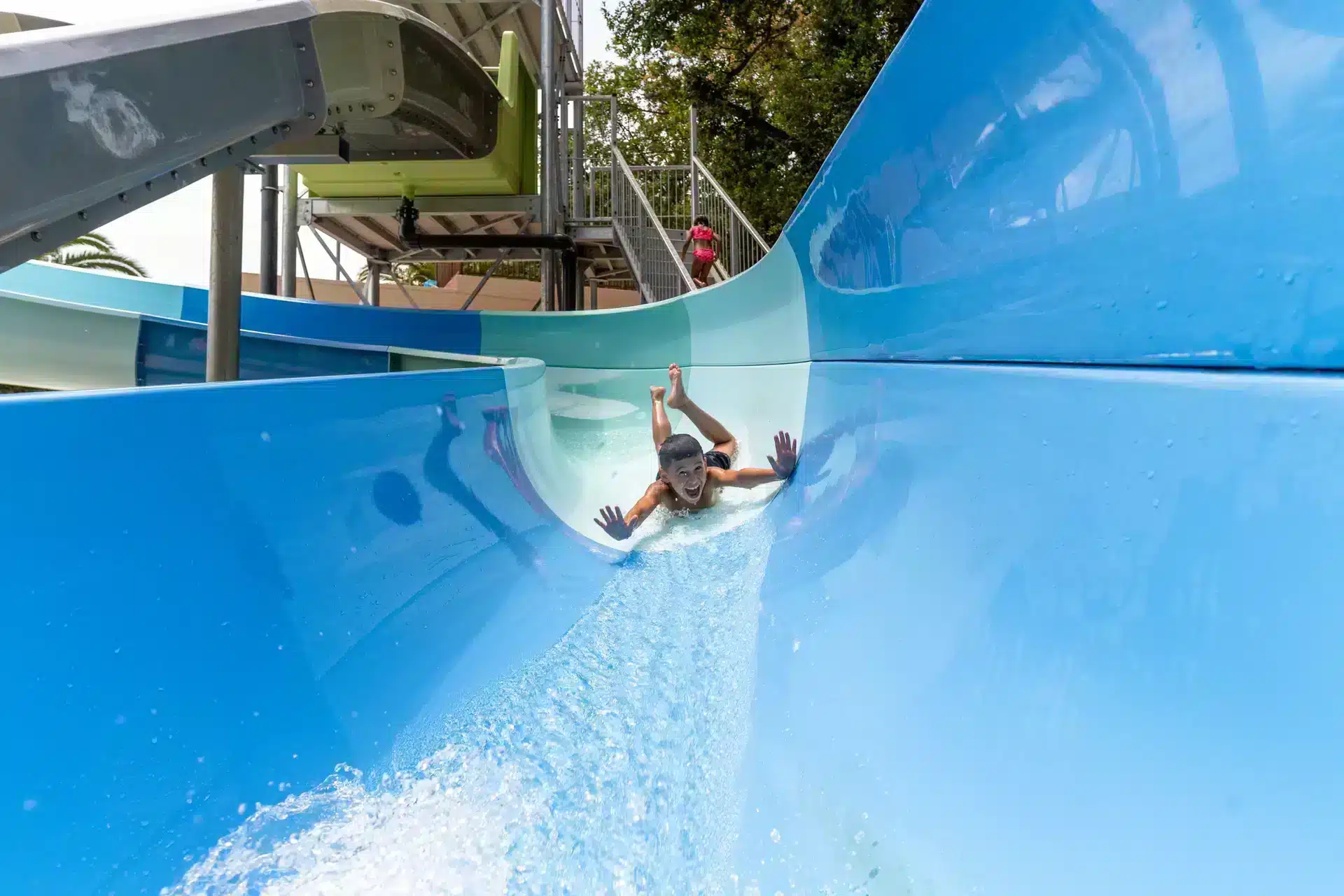 child slides down the slide